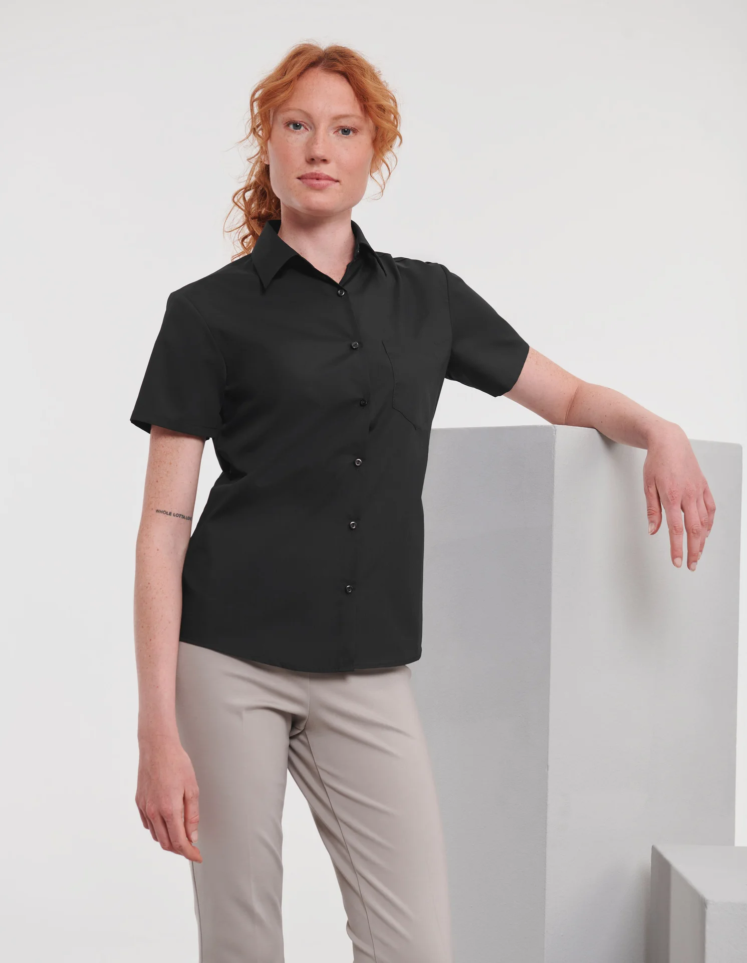 russell-r935f-ladies-short-sleeve-poly-cotton-easy-care-poplin-shirt-black-model-1 Russell Ladies Short Sleeve Polycotton Easy Care Poplin Shirt