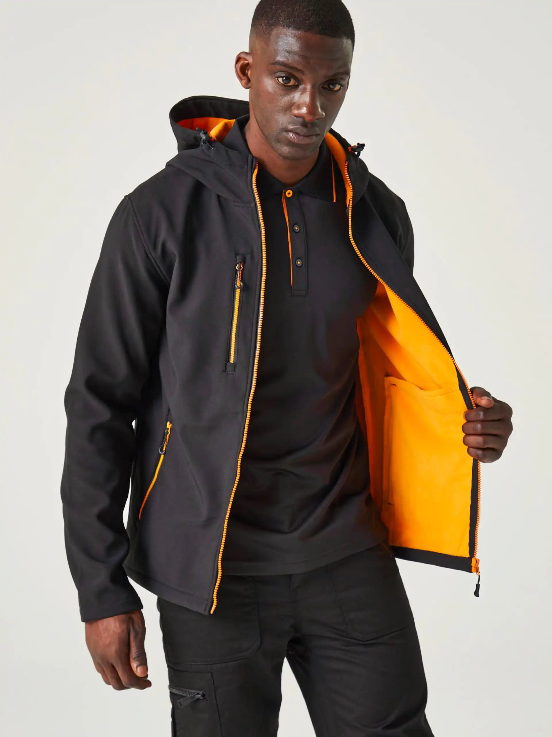 regatta-tra705-navigate-2-layer-hooded-softshell-jacket-black-orange-pop-model-1 Regatta Navigate 2-Layer Hooded Softshell Jacket