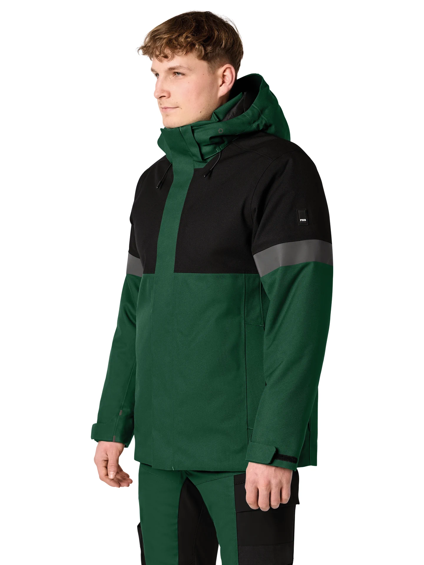 fhb-80236-winterjacke-adrian-gruen-schwarz-model-1 FHB Winter-Arbeitsjacke ADRIAN